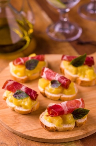 Cup of bruschetta with pineapple and mustard sauce